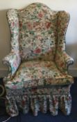 A Georgian style arm chair attractively upholstered with animals of stylised form.