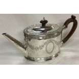 An 18th Century George III bright-cut silver teapot.