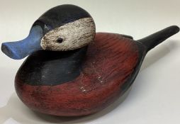 GUY TAPLIN: (British, born 1939): A painted wood sculpture in the form of a duck.