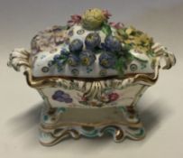 An attractive Victorian inkwell decorated with flowers and leaves.