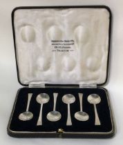 A boxed set of six silver coffee spoons.