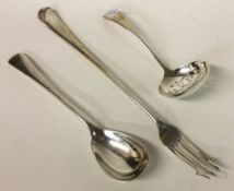 An Edwardian silver sifter spoon together with a preserve spoon and pickle fork.