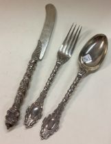 A three piece silver christening set.