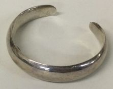 A Sterling silver bangle.