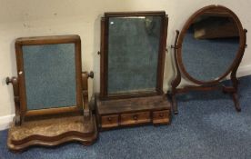 Three Antique mahogany toilet mirrors.