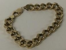 A heavy 9 carat curb link bracelet.