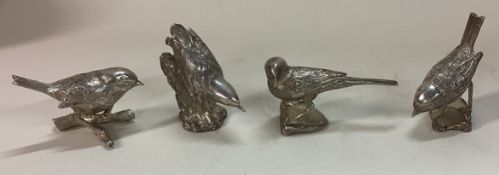 A fine set of four silver menu holders in the form of game birds.