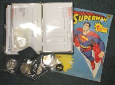 A collection of Royal Mint Proof coins together with a Superman comic.