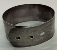 An engine turned Sterling silver bangle.
