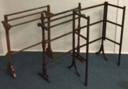 A group of three mahogany towel rails. Est. £20 -