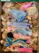 Four boxes of Barbie dolls.