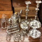 A good pair of silver plated candlesticks together with a toast rack etc.