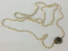 A good Georgian pearl necklace with gold hair clasp.