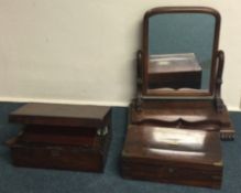 Two mahogany hinged top writing boxes together with a toilet mirror.
