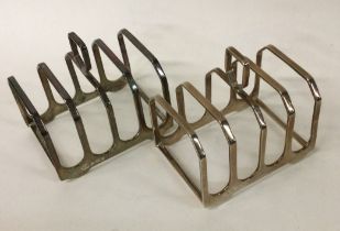 A heavy pair of stylish silver toast racks.