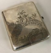 A heavy 20th Century Russian silver cigar case engraved with village scene.