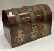 A domed top and brass mounted tea caddy.