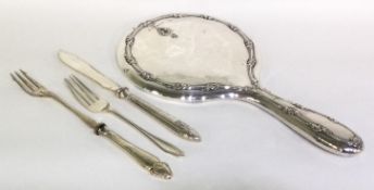 A silver mounted dressing table mirror together with a butter knife etc.