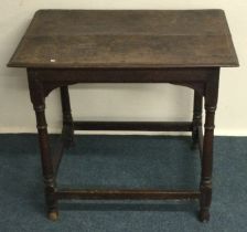 An antique oak plank top table. Est. £30 - £50.