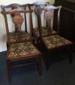 A set of four Edwardian dining chairs with shell decoration.