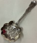 An American silver ornate pierced spoon.