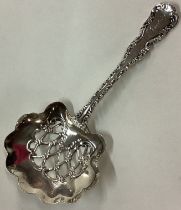 An American silver ornate pierced spoon.