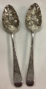 A pair of heavy 18th Century George III silver berry / fruit spoons.