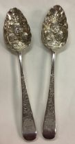 A pair of heavy 18th Century George III silver berry / fruit spoons.