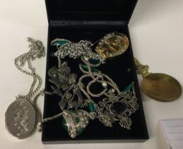 A box containing silver jewellery, caddy spoon etc.