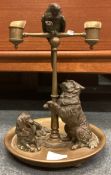 A good quality bronze candelabra attractively decorated with a parrot together with a pair of dogs.