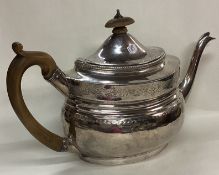 A fine Georgian silver bright-cut teapot.
