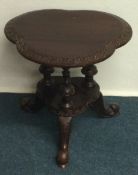 A small Victorian carved table.