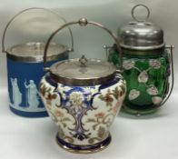 A group of three silver plated biscuit barrels.