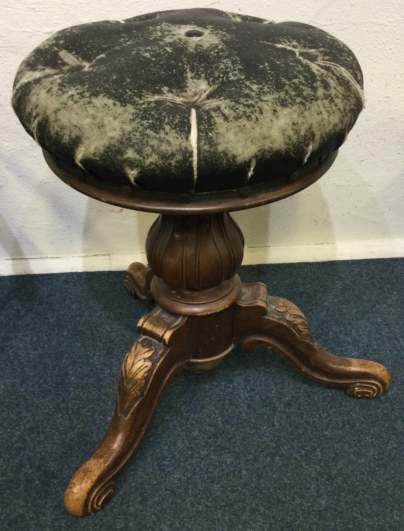 A Victorian stool with a leather top.