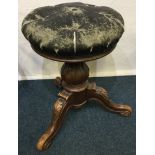 A Victorian stool with a leather top.
