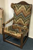A good early oak chair with tapestry padding to stretcher base.