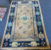 A stylish tapestry rug with central medallion.