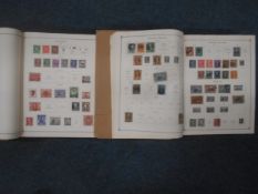 Two various sparsely collated International postage stamp albums up to 1950s.