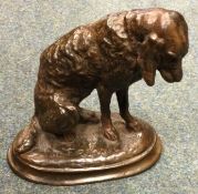 EMMANUEL FRÉMIET: (French, 1824 - 1910): A bronze figure of a seated hound.