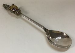 A heavy enamelled Queen's Beast silver spoon.