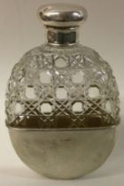 A large Victorian silver and cut glass flask with detachable cup.