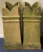 A pair of tall tapering chimney pots.