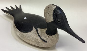 GUY TAPLIN: (British, born 1939): A painted wood sculpture in the form of a duck.