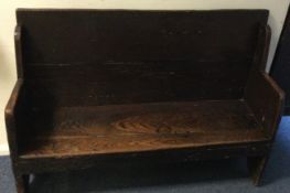 A good oak plank top monks bench of rectangular form.