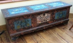 A good Antique trunk with painted decoration to hinged top.