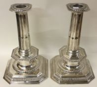 A fine pair of of Queen Anne style cast silver candlesticks.