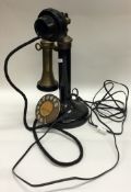 An unusual brass mounted telephone.