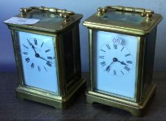 Two brass carriage clocks with white enamelled dial.