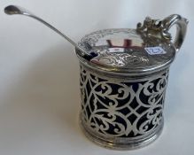 A large Victorian silver pierced mustard pot.