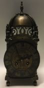 A good brass lantern clock with gilt dial.